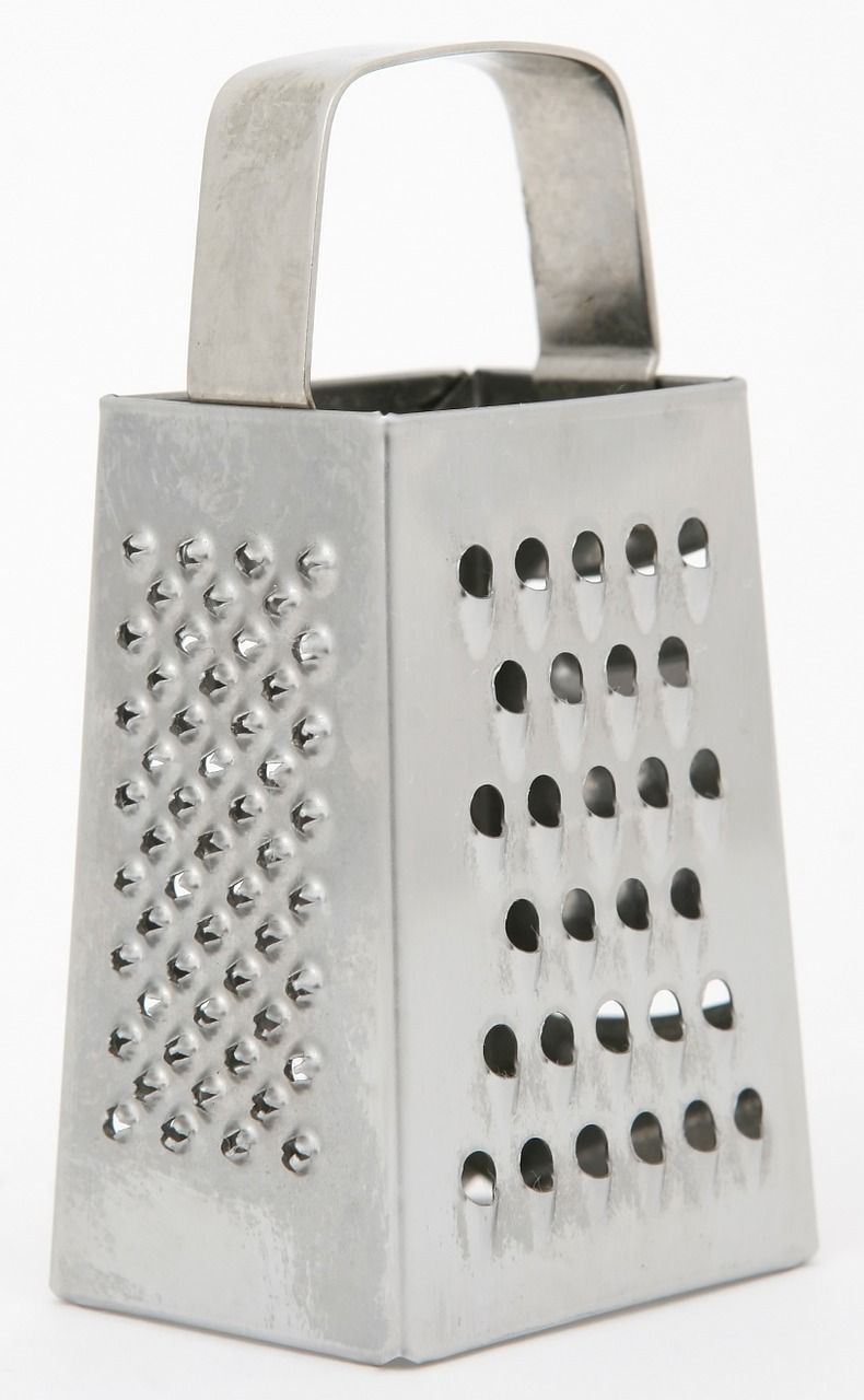 Grating the eggs for egg salad is so fast and easy using the grater. Use the large holes.