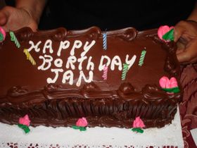 Happy BORTHDAY Jan. The Italian baker could not spell, but he could make a great 3 color cookie cake. This was a very tasty decadent dark chocolate frosting.
